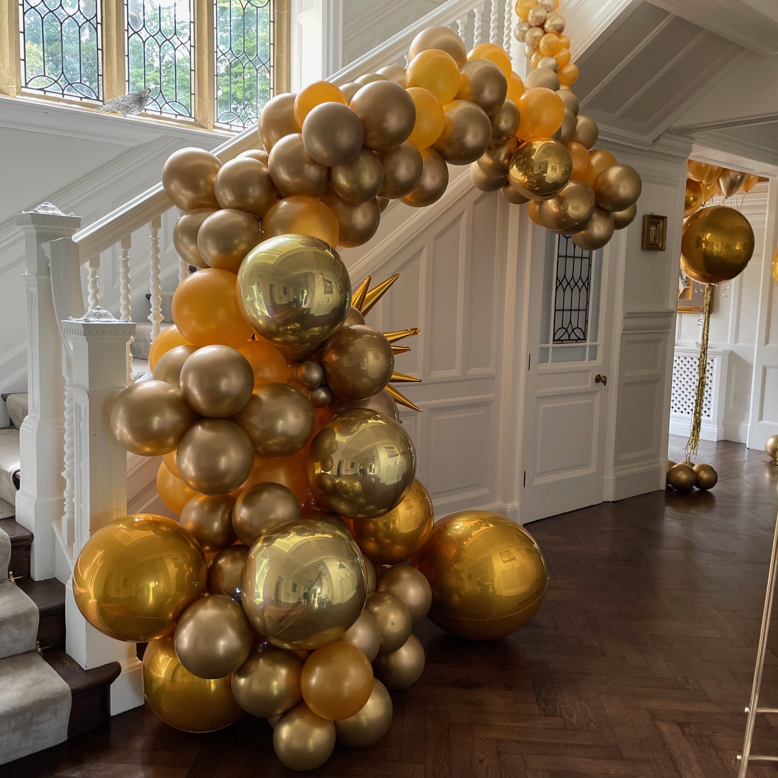 Gold organic demi balloon arch