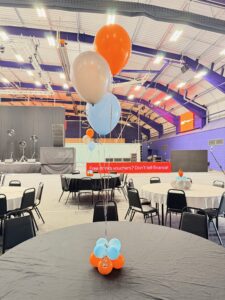 Natural latex balloon décor in orange, cream and ice blue for the Westfield Health Westfest family day