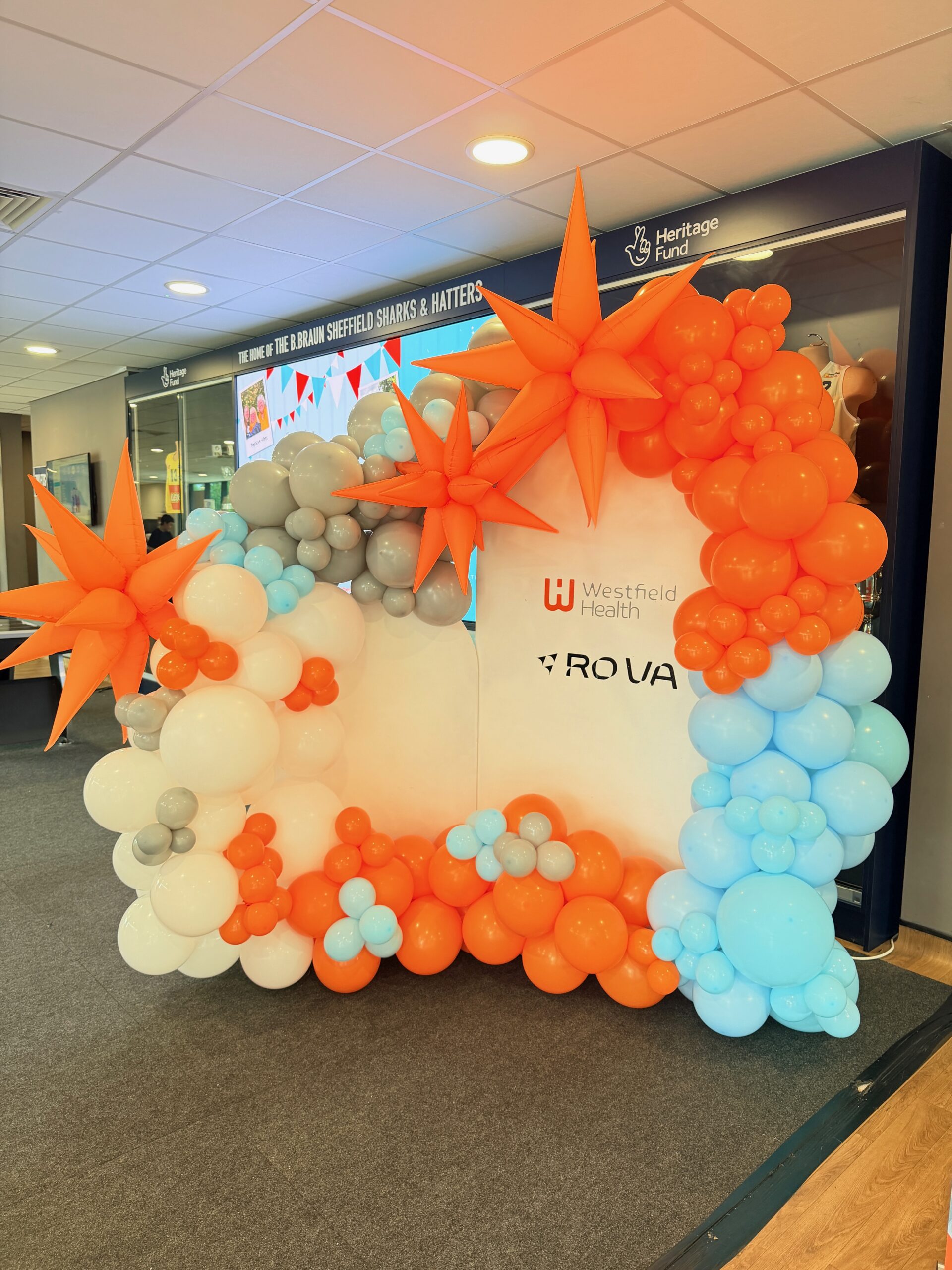 Westfield Health Westfest table and entrance balloon décor in natural latex